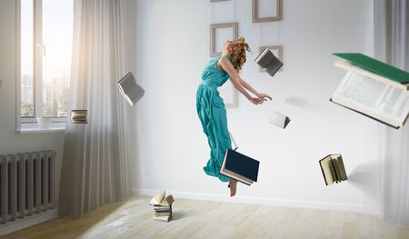 Woman floating with around books in room concept. mixed media