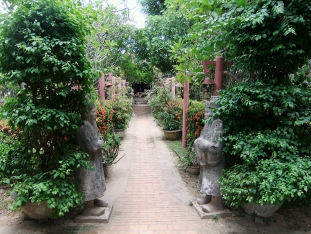 stock photo two warrior statues guarding the pathway in a beautiful scenic vietnamese garden - Vietnamese Garden stock photo two warrior statues guarding the pathway in a beautiful scenic vietnamese garden - Vietnamese Garden