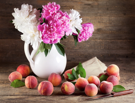 Peach flower: Still life with bouquet of peonies and peaches
