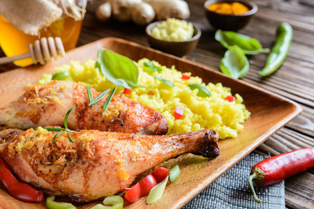 Muslos De Pollo Al Horno Con Miel Jengibre Rallado Y Arroz Con Cúrcuma En Un Fondo De Madera Fotos Retratos Imágenes Y Fotografía De Archivo Libres De Derecho Image 61074933<script async src=
