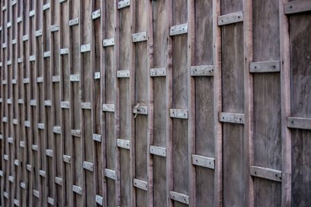 Old house along walking street(Chai Khong Road) in Chiang Khan,Loei,Thailand.Close-up the wall.
