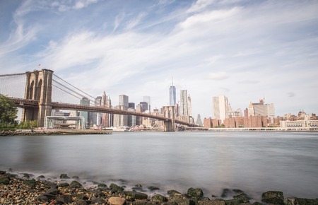 New york city skyline and brooklyn bridge long exposure image to improve the artistic side of the city Stock Photo