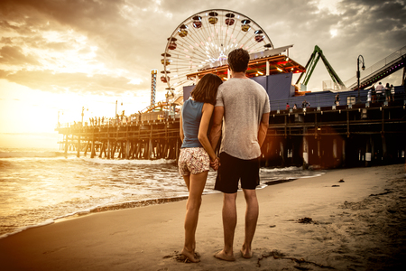 Happy couple spending time in Santa monica Фото со стока