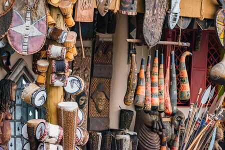 Variety of african souvenirs exposed for sale in local market Stock Photo