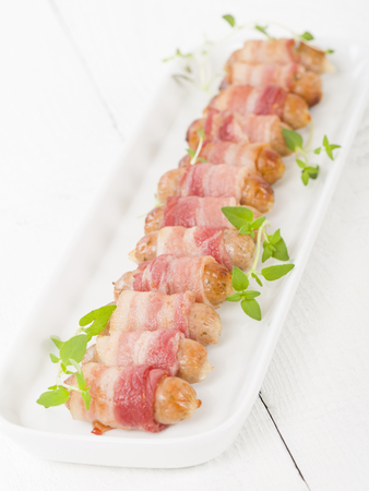 pigs in blankets sausages wrapped in bacon traditional british christmas dinner side dish - British Christmas Dinner pigs in blankets sausages wrapped in bacon traditional british christmas dinner side dish - British Christmas Dinner