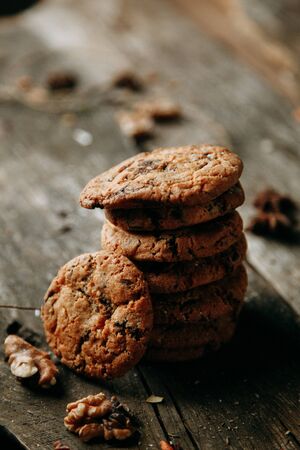 Baking on a flatley wooden background oatmeal cookies with jam croissants with raspberry jam