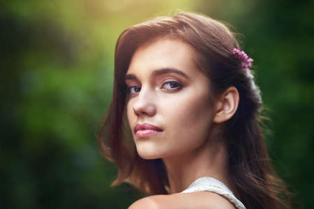 Her Beauty As Captivating As New Flowers In Spring. A Beautiful Young Woman Posing In Nature.