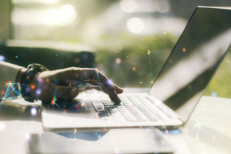 Creative concept of wireless technology and hands typing on laptop on background big data and database concept multiexposure