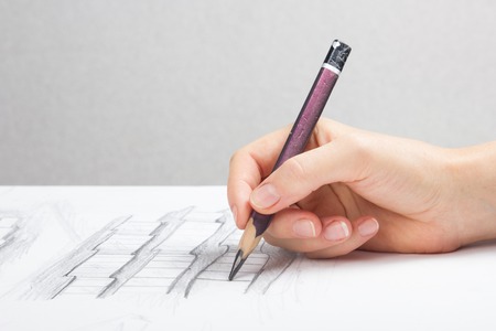 Architect working on blueprint architects workplace architectural project blueprints ruler calculator laptop and divider compass construction concept engineering tools Stock Photo