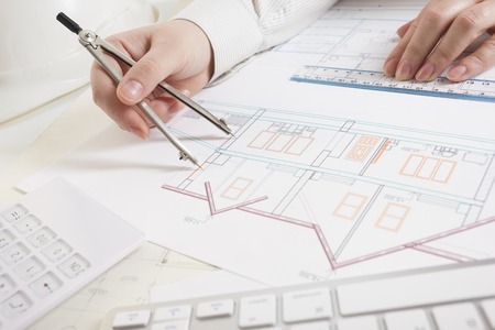 architects working on blueprint real estate project architect