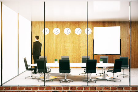 Thoughtful young businessman in modern conference roon with blank whiteboard mock up 3d rendering