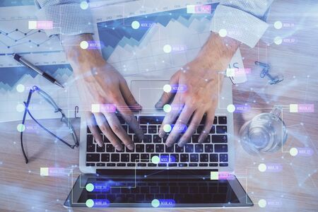 Businessman with computer background with technology theme hologram concept of big data double exposure