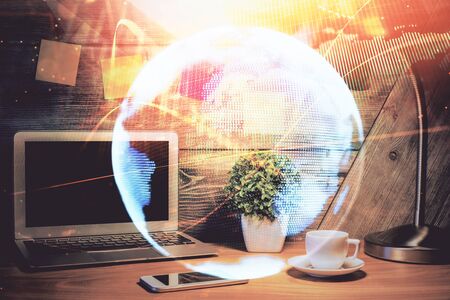 Double exposure of business theme icons and work space with computer background concept of success