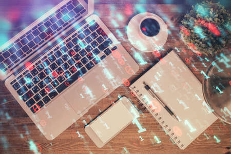 Multi exposure of data theme drawing hologram over topview work desk background with computer concept of technology Stock Photo