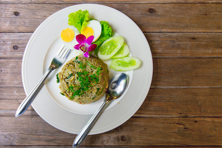green curry fried rice recipe spicy and flavorful hot thai kitchen food on wood table stock - Hot Thai Kitchen green curry fried rice recipe spicy and flavorful hot thai kitchen food on wood table stock - Hot Thai Kitchen