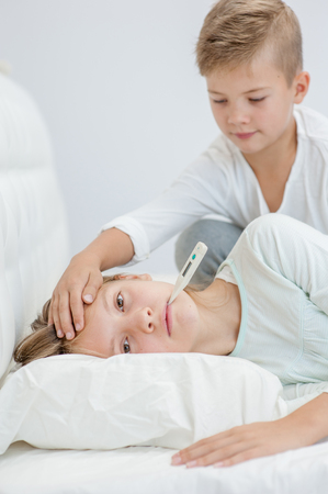 Brother Touches The Forehead Her Sister Checking The Temperature Stock Photo 89136900 Brother Touches The Forehead Her Sister Checking The Temperature Stock Photo 89136900