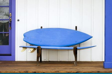 a playful surfboard bench on a porch in colorado stock photo