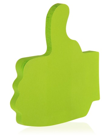 green sticky note stuck in the shape of a raised thumb like stock