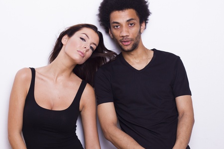 Young interracial couple on white isolated background