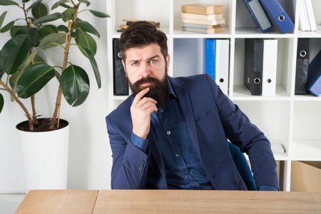 answer common interview questions man bearded hr manager sit interview questions for an office manager