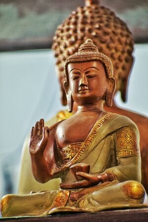 back to back idol of lord buddha stock photo picture and royalty