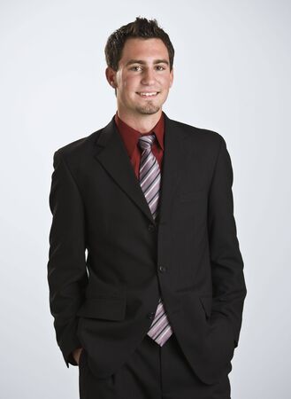 attractive male looking at the camera smiling 3 4 body shot