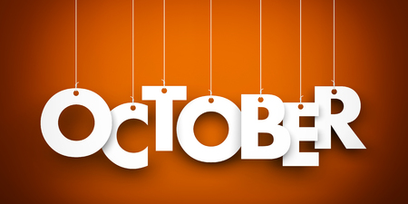 October word suspended by ropes on brown background - 46421582