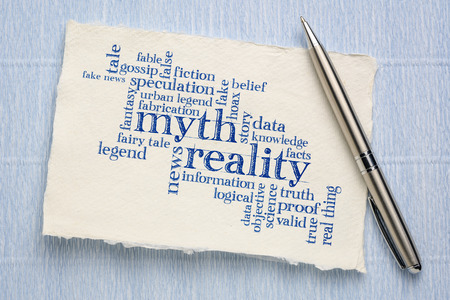 myth versus reality word cloud - handwriting on a sheet of rough Khadi paper
