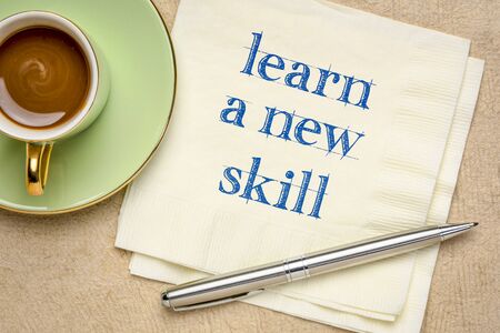 learn a new skill motivational note - handwriting on a napkin with a cup of coffee, personal development and growth concept