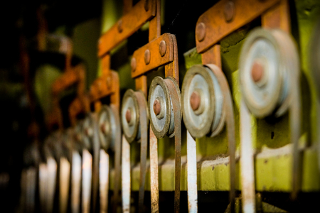 Close-up on vintage rusty machine used in leather industry Stock Photo