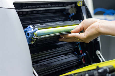 Technicians replacing toner in laser printer concept office supplies repair - 169357967