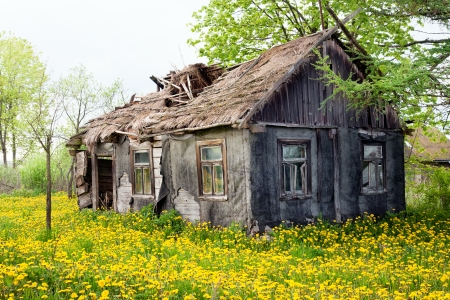 Dilapidated cottage house Фото со стока