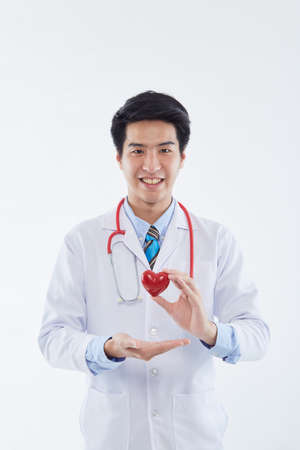 Covid-19, preventing the virus, healthcare workers, and preventing virus concept. friendly looking smiling asian male doctor