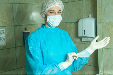 [Image: 55130147-surgeon-woman-in-a-robe-prepare....jpg?ver=6]