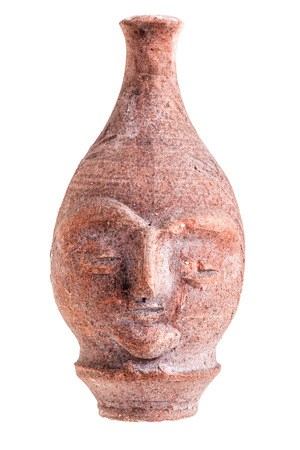 An Ancient Terracotta Vase Or Jug Shaped Like A Human Face