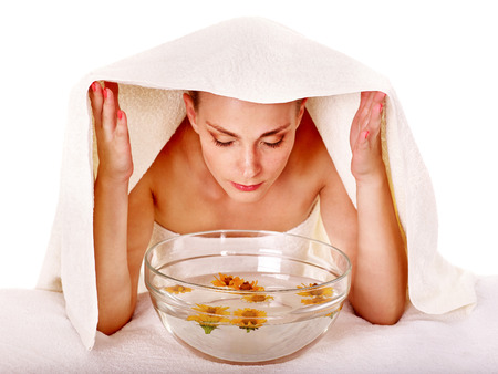 Facial massage with steam treatment.Towel on head - 35974975