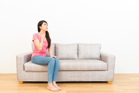 uncomfortable couch old time pretty woman feeling throat uncomfortable during cold period sitting on couch holding neck looking at white pretty woman feeling throat uncomfortable during cold period stock uncomfortable couch old time pretty woman feeling throat uncomfortable during cold period sitting on couch holding neck looking at white pretty woman feeling throat uncomfortable during cold period stock