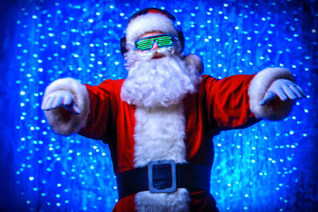 dj santa claus in luminous glasses and headphones christmas stock dj christmas