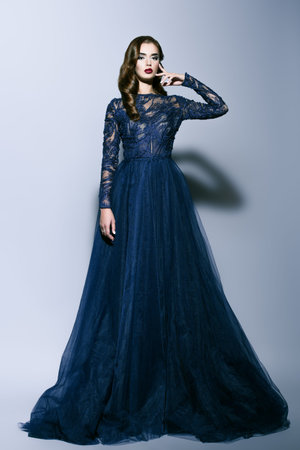 A full length portrait of a beautiful brunette lady. evening dress. fashion, beauty. Stock Photo