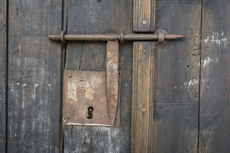 Closeup Vintage Door Lock Of External Antique Wooden Door With Closeup vintage door lock of external antique wooden door with a door pin lock, weathered - Closeup Vintage Door Lock Of External Antique Wooden Door With