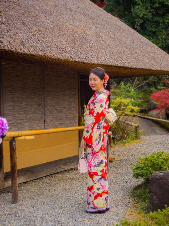 HAKONE, JAPAN - JULY 02, 2017: Unidentified woman posing for camera and enjoying the view of the city in Kyoto Editorial