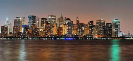 New york city manhattan downtown skyline at dusk with skyscrapers illuminated over hudson river panorama Stock Photo