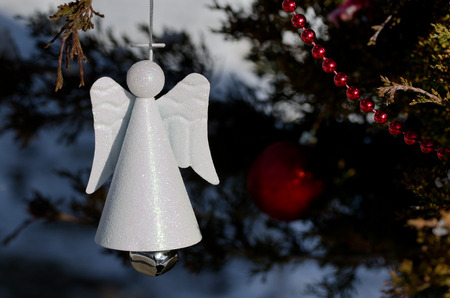 Stock Photo White Angel Christmas Ornament Decorating An Outdoor Tree Stock Photo White Angel Christmas Ornament Decorating An Outdoor Tree