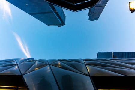 Low Angle View On Commercial Glass Buildings With Sky. Up View In Manhattan, New York City