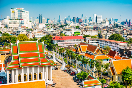 Aerial view of Bangkok monastery and modern office buildings