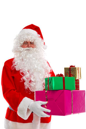 santa claus holding some christmas presents isolated on a white