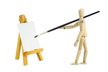 wooden mannequin with an easel with a blank canvas to be used