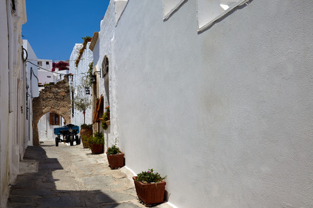 Street in greek town, lindos city, rhodos island, greece Stock Photo
