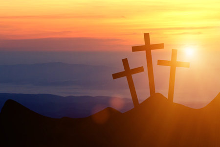 Jesus Christ cross on a background with dramatic sky, lighting, colorful red, orange sunset, dark clouds, sunbeams, sun rays glowing behind the three wooden crosses on Golgotha mountain.Easter, resurrection, Good Friday concept. - 162645042