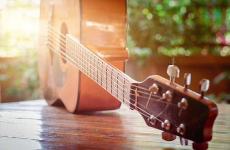 Classical guitar on the table with bokeh background depth of field